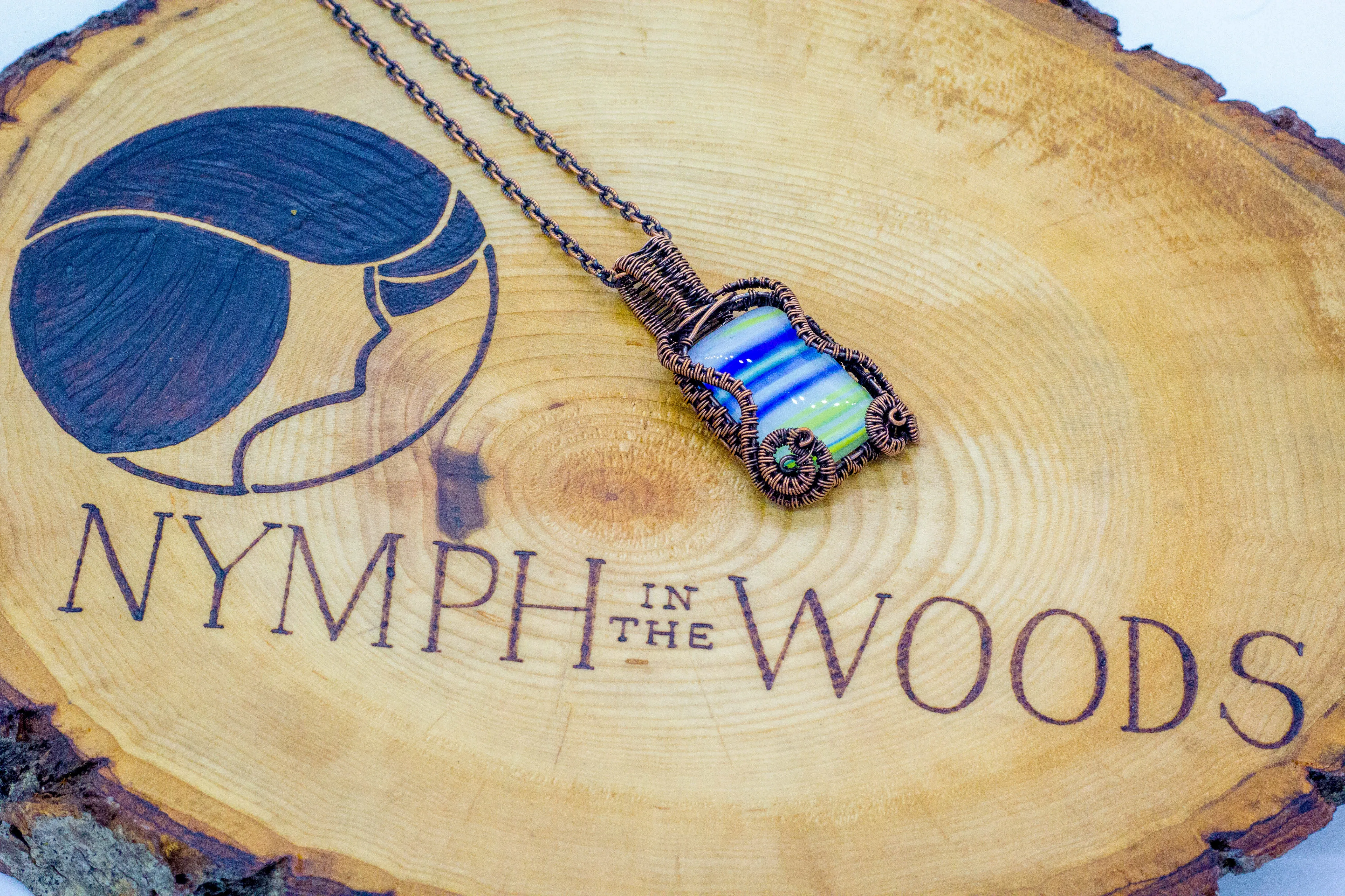 Blue, White, and Yellow Fused Glass Pendant with Copper Wire Wrapping