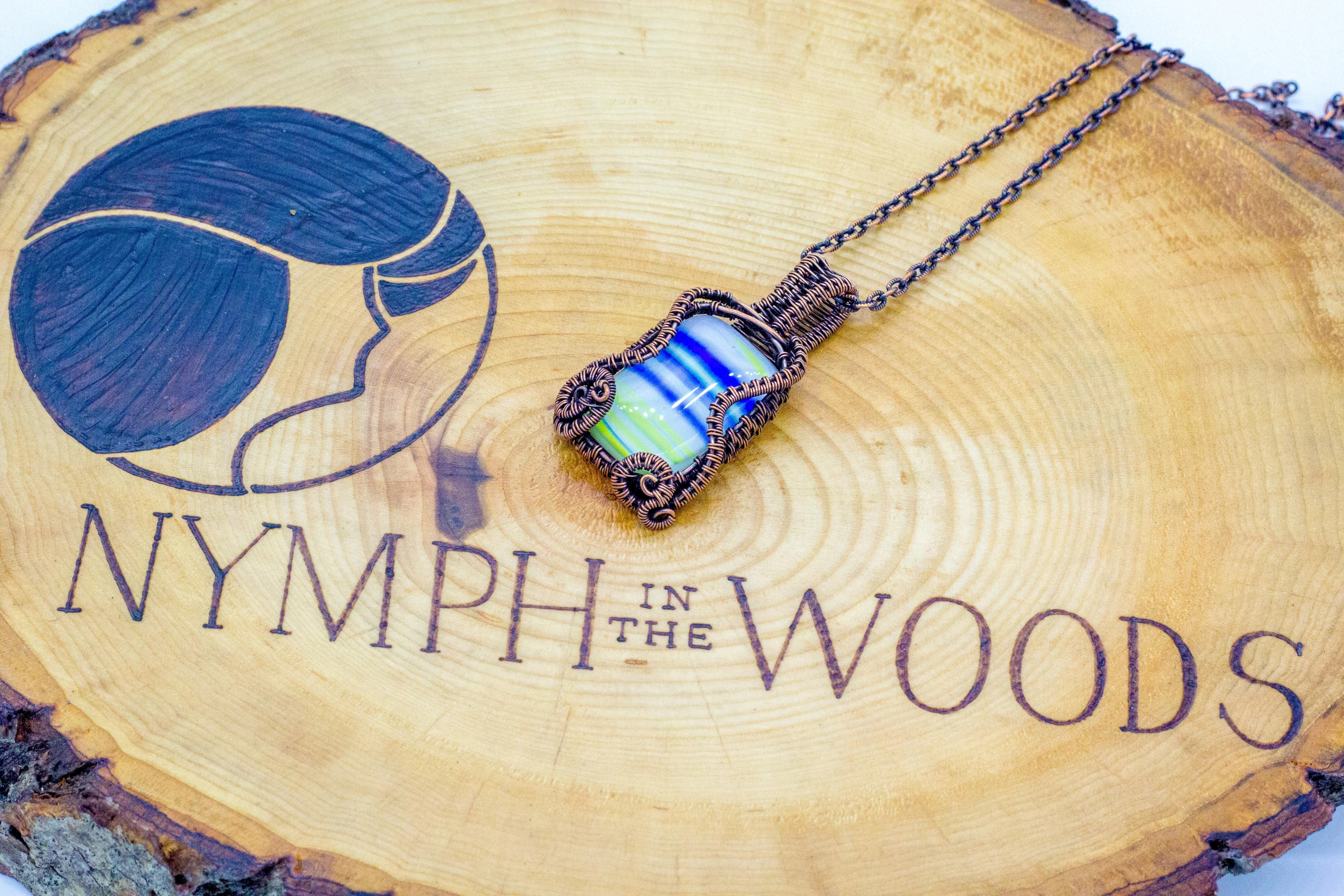 Blue, White, and Yellow Fused Glass Pendant with Copper Wire Wrapping