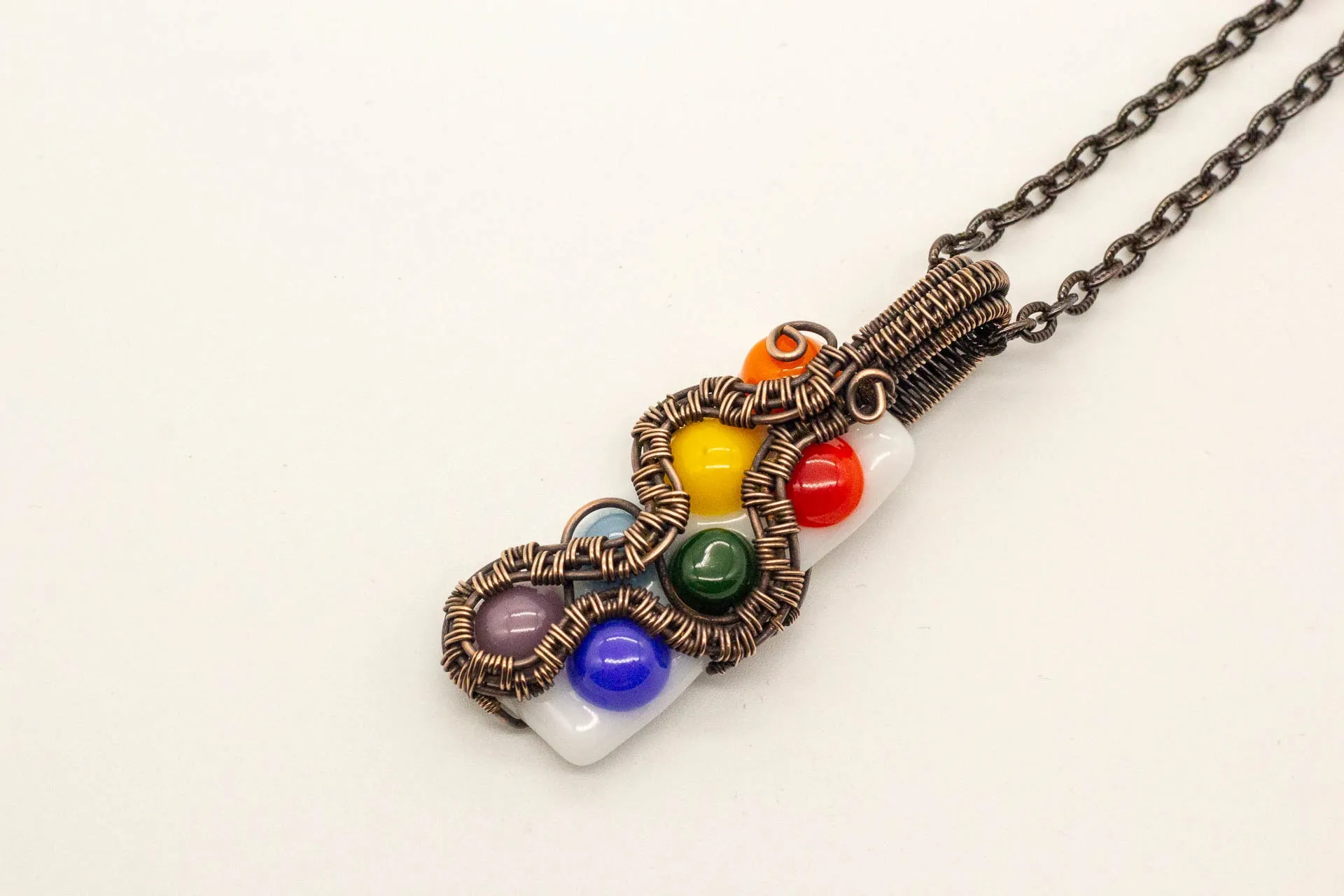 Chakra-Inspired Fused Glass Pendant with Copper Wire Wrapping