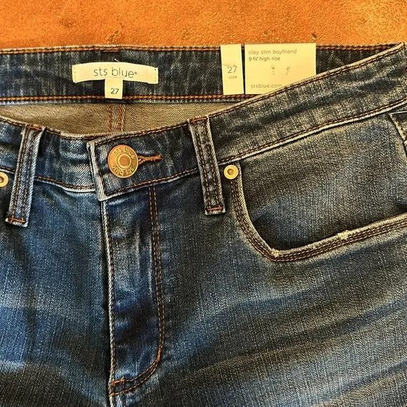 NWT STS Blue boyfriend slim jeans size 27. Waist flat 15”. Inseam cuffed 27”.