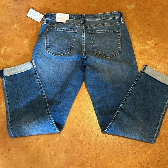 NWT STS Blue boyfriend slim jeans size 27. Waist flat 15”. Inseam cuffed 27”.