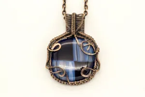 Reserved - Copper Wire Wrapped Pendant with Streaked Blue and Black Fused Glass