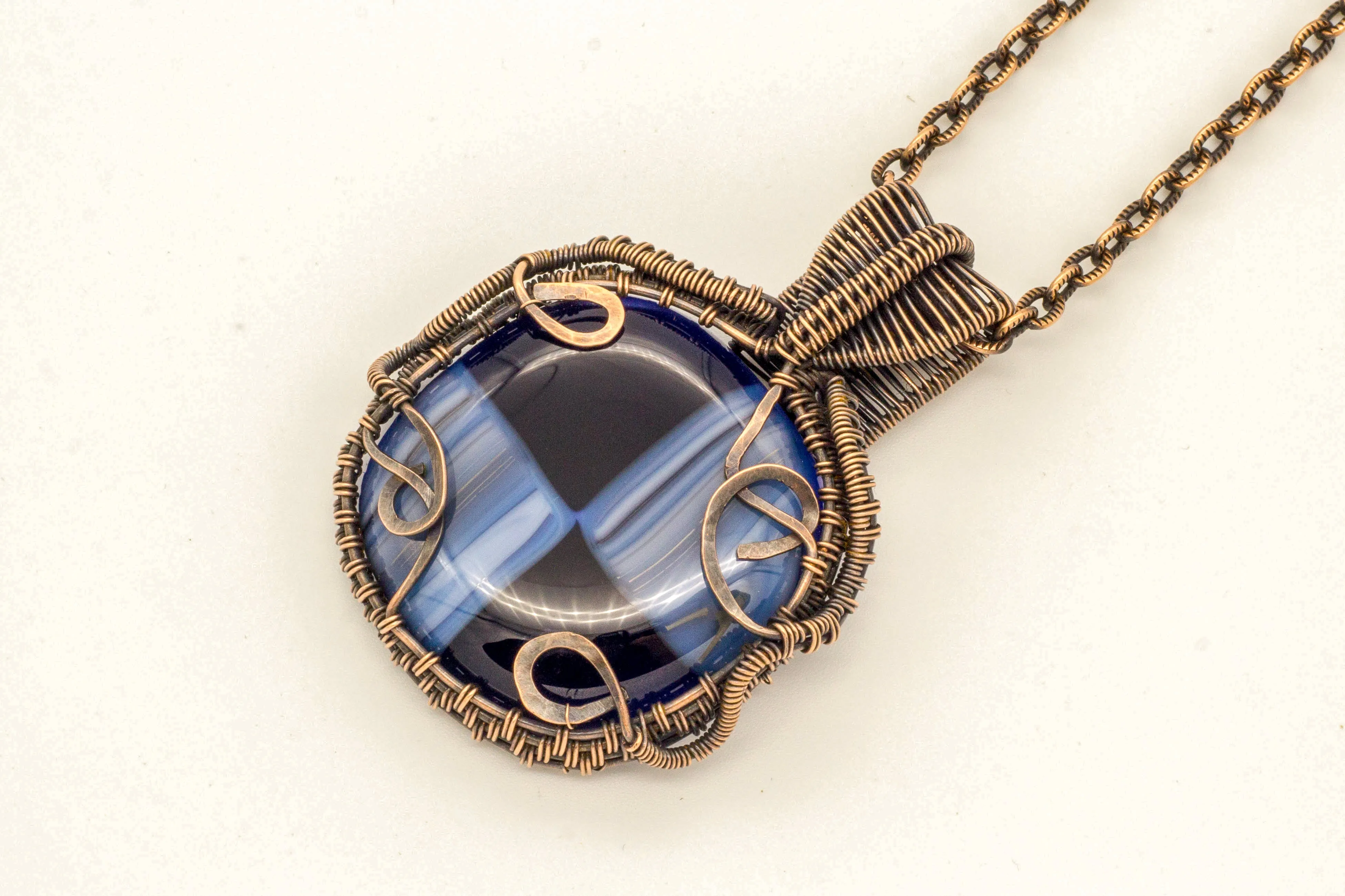Reserved - Copper Wire Wrapped Pendant with Streaked Blue and Black Fused Glass