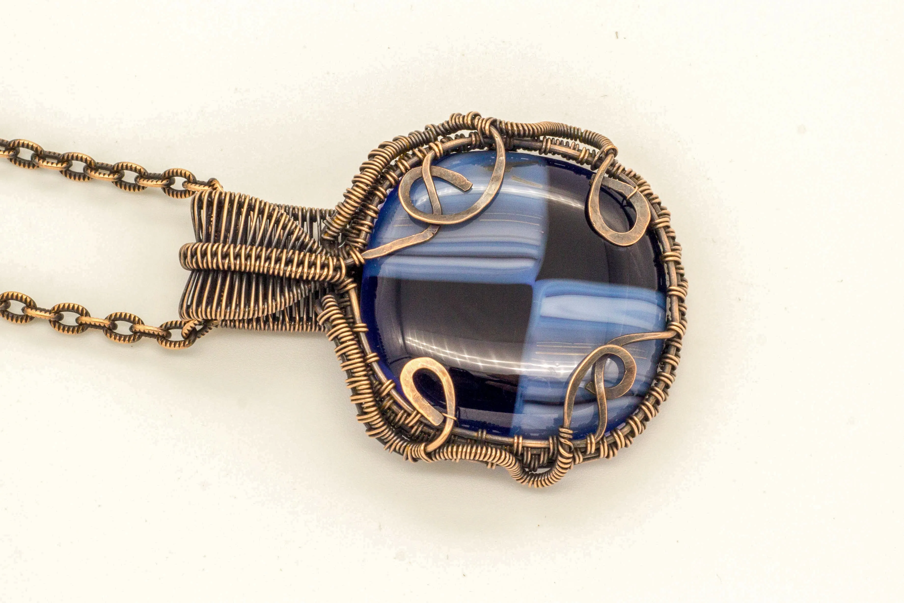 Reserved - Copper Wire Wrapped Pendant with Streaked Blue and Black Fused Glass