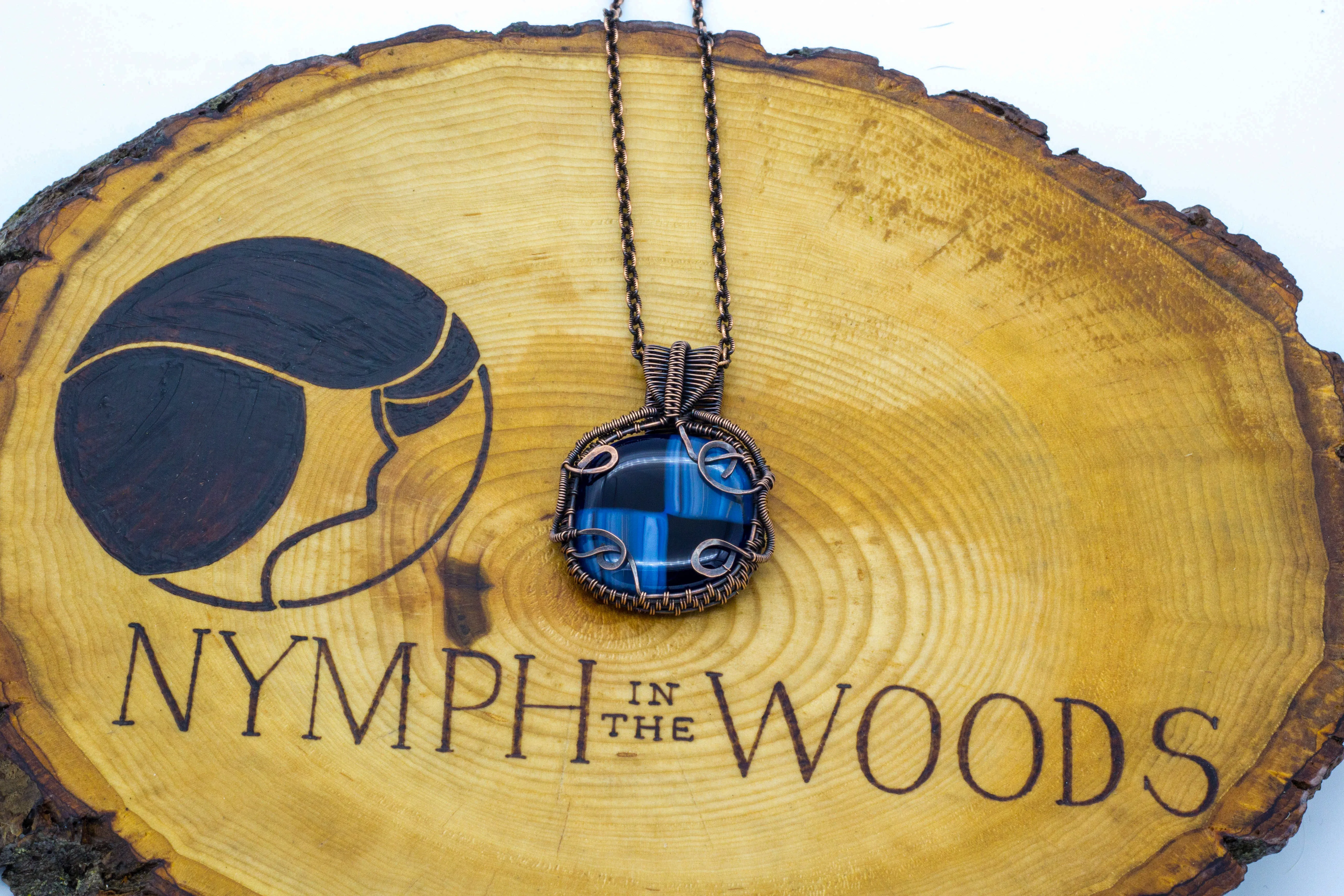 Reserved - Copper Wire Wrapped Pendant with Streaked Blue and Black Fused Glass