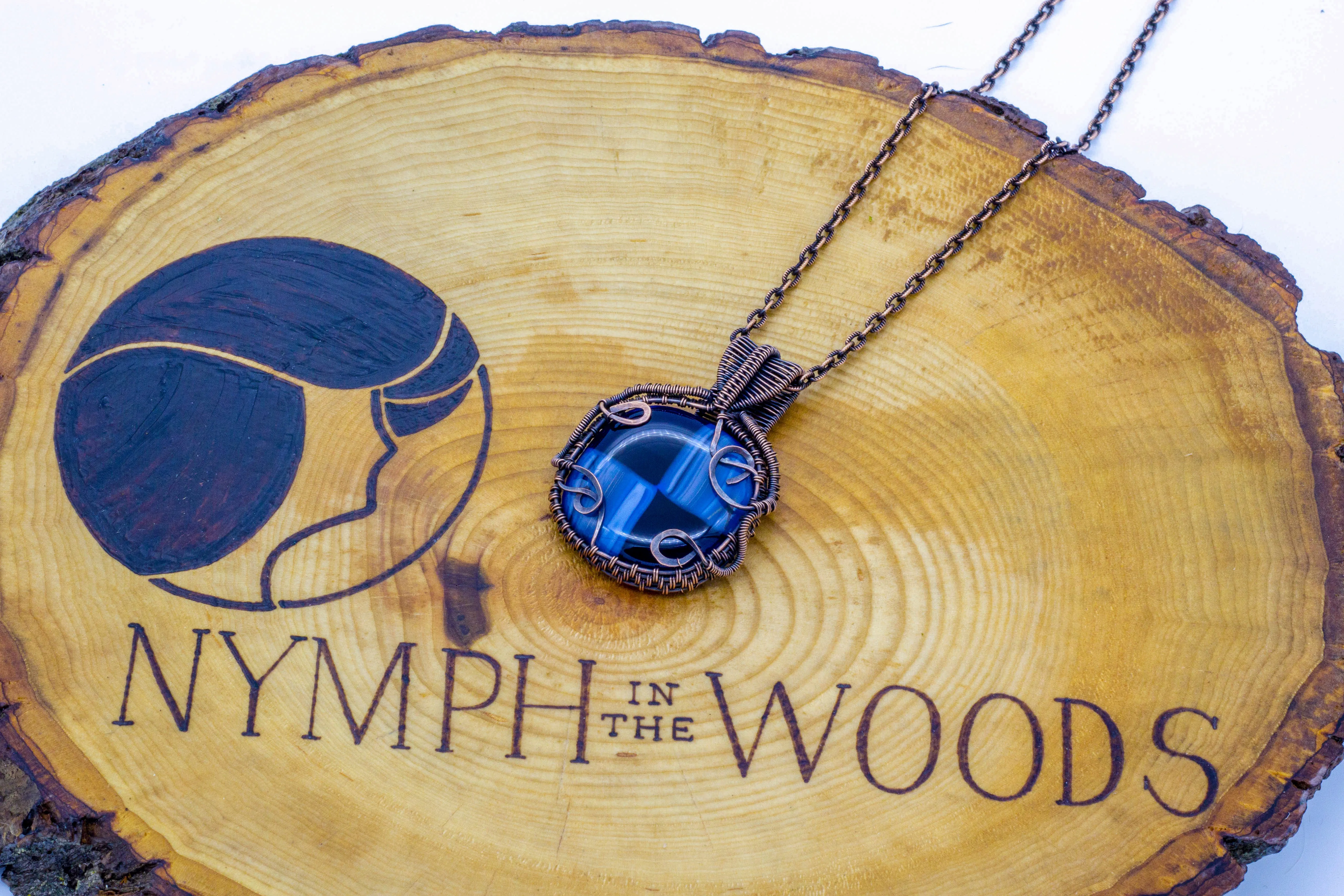 Reserved - Copper Wire Wrapped Pendant with Streaked Blue and Black Fused Glass