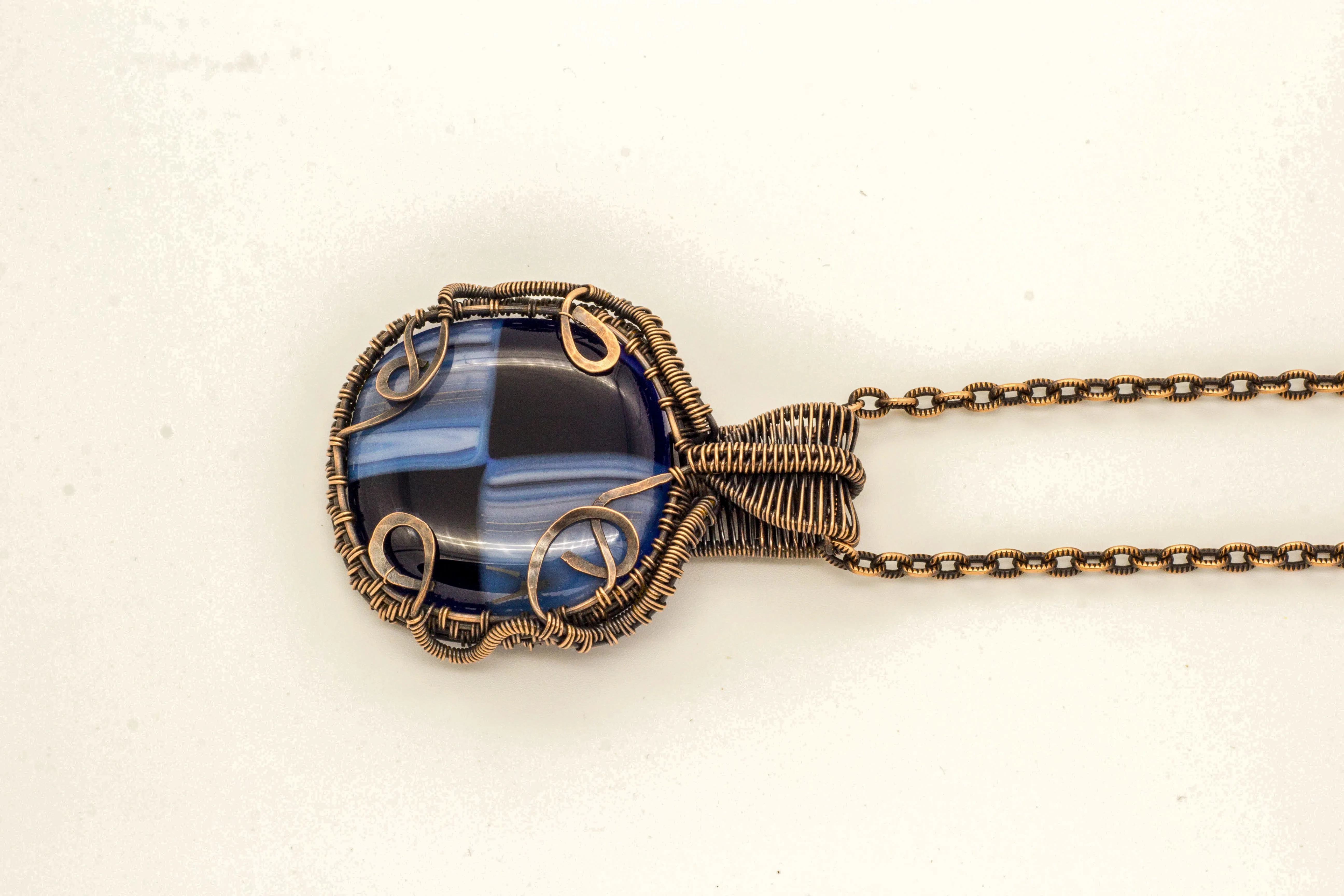 Reserved - Copper Wire Wrapped Pendant with Streaked Blue and Black Fused Glass
